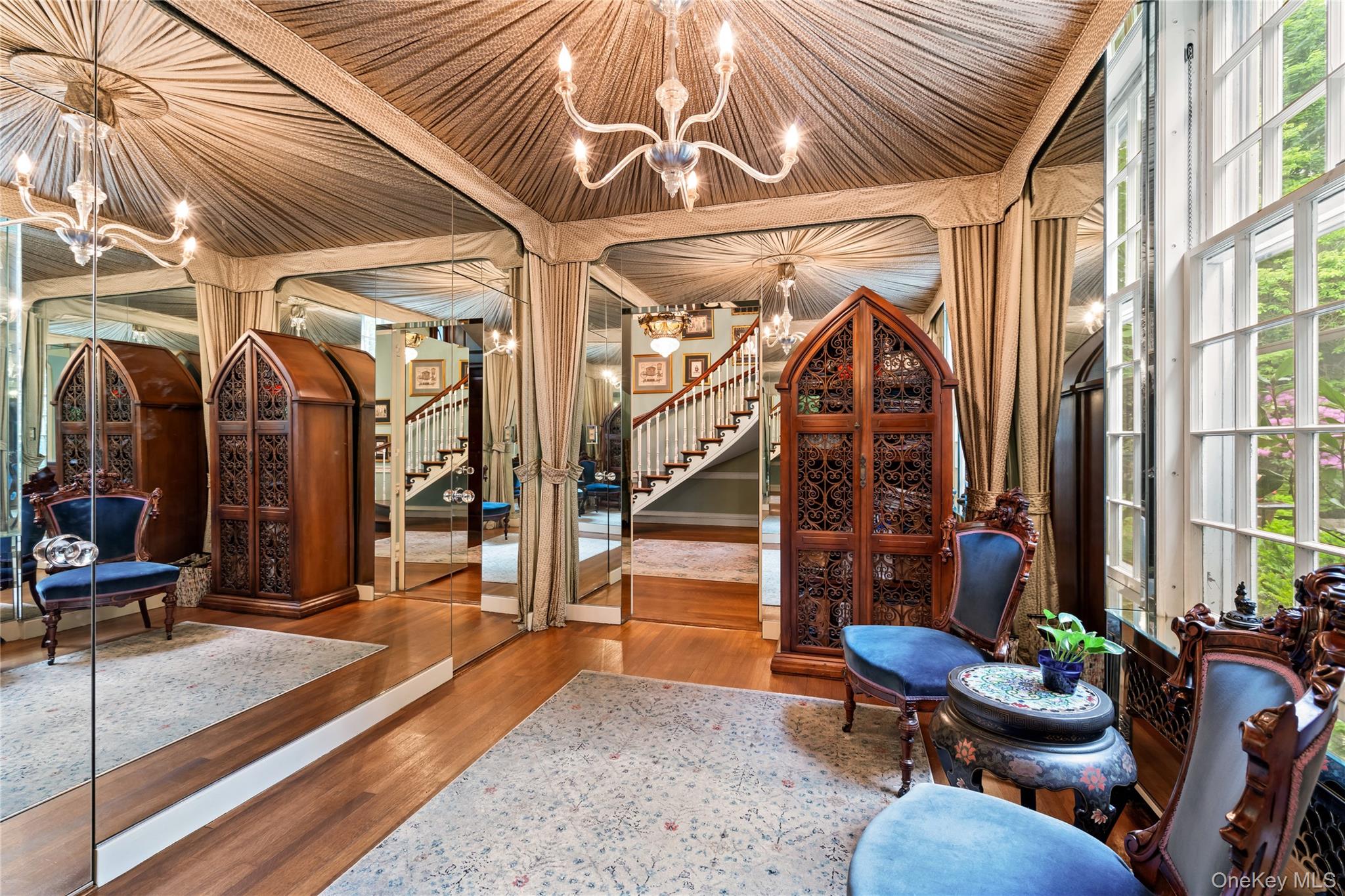 88 Wheatley Road Old Westbury, NY 11568 - Photo 4 of 40 Wine area featuring a chandelier and wood finished floors