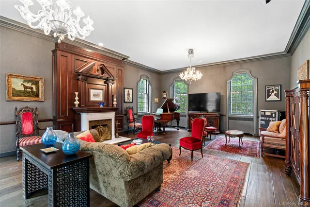 a living room with fireplace furniture and a flat screen tv