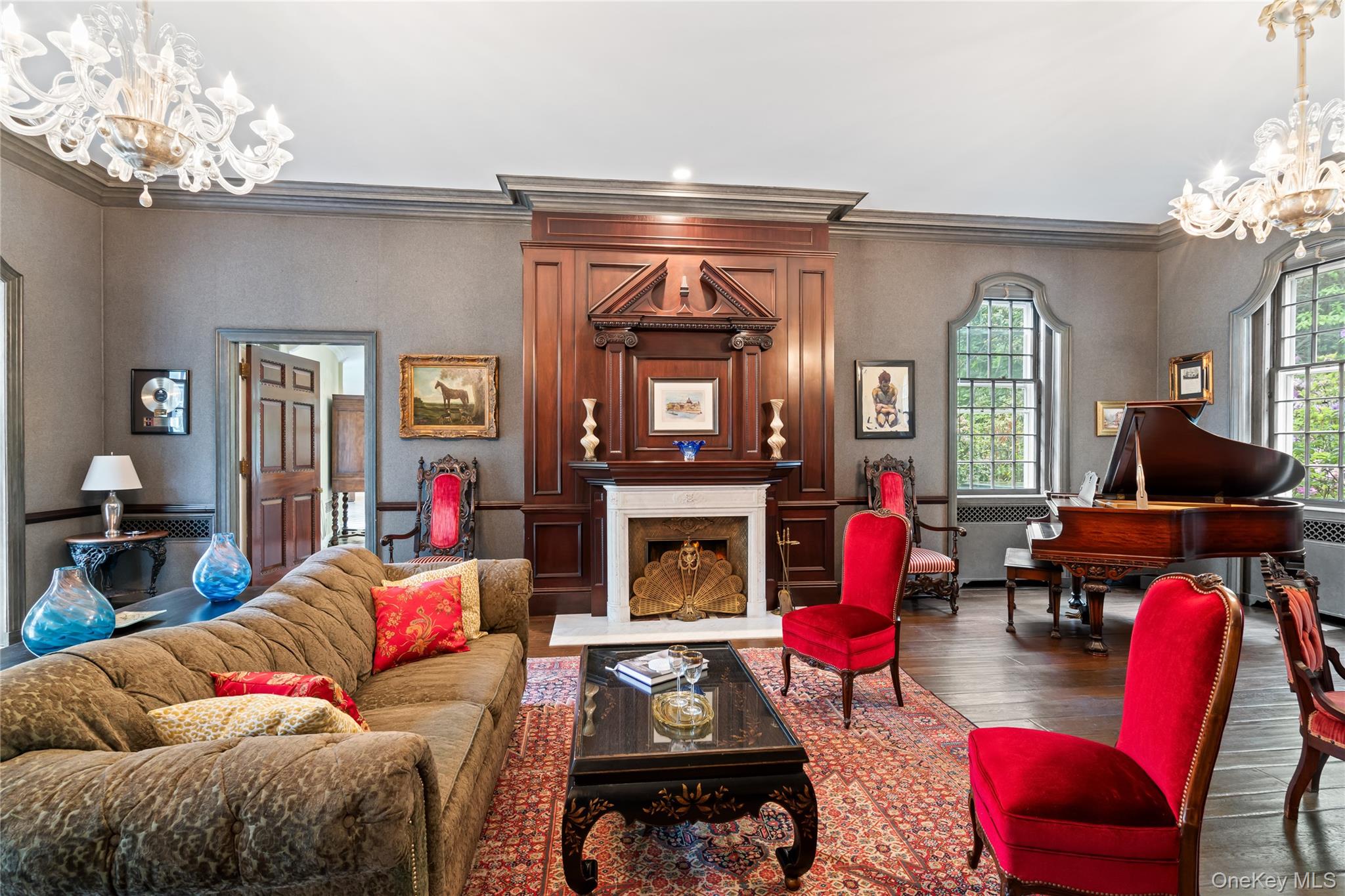 88 Wheatley Road Old Westbury, NY 11568 - Photo 7 of 40 Living room with a chandelier, wood finished floors, ornamental molding, and a premium fireplace