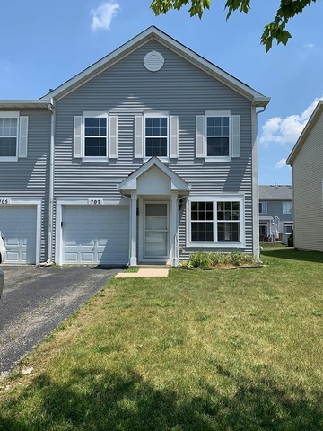 707 Shannon Drive Romeoville, IL 60446 - Photo 1 of 14 a front view of a house with a garden
