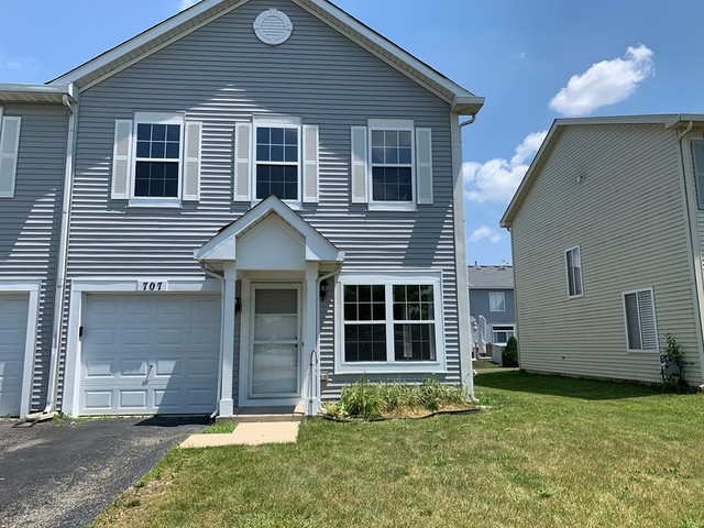 707 Shannon Drive Romeoville, IL 60446 - Photo 2 of 14 a front view of a house with a yard