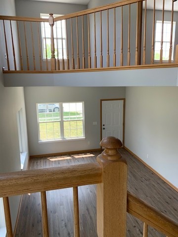 707 Shannon Drive Romeoville, IL 60446 - Photo 8 of 14 a view of entryway with wooden floor