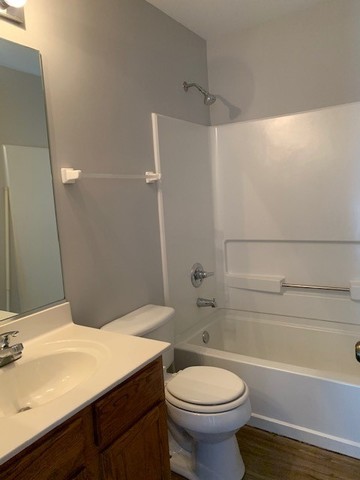 707 Shannon Drive Romeoville, IL 60446 - Photo 10 of 14 a bathroom with a sink a toilet and shower