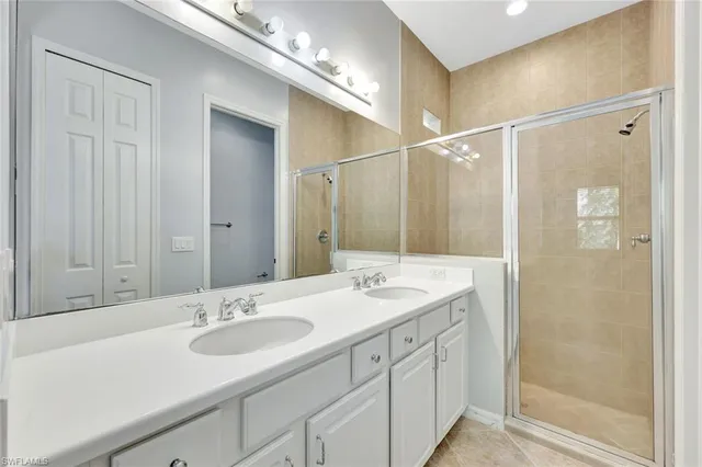 a bathroom with a sink double vanity and a mirror