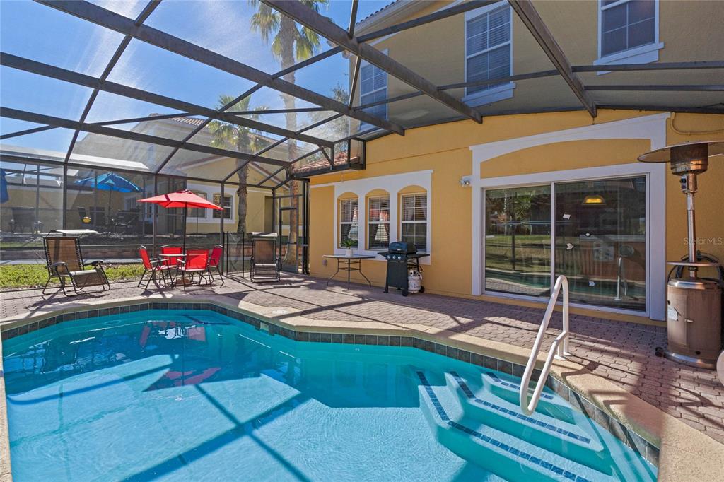 8535 Bay Lilly Loop Kissimmee, FL 34747 - Photo 27 of 57 a view of a backyard with table and chairs