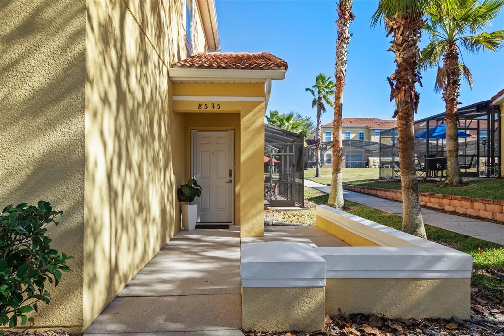 8535 Bay Lilly Loop Kissimmee, FL 34747 - Photo 29 of 57 a front view of a house with a garden