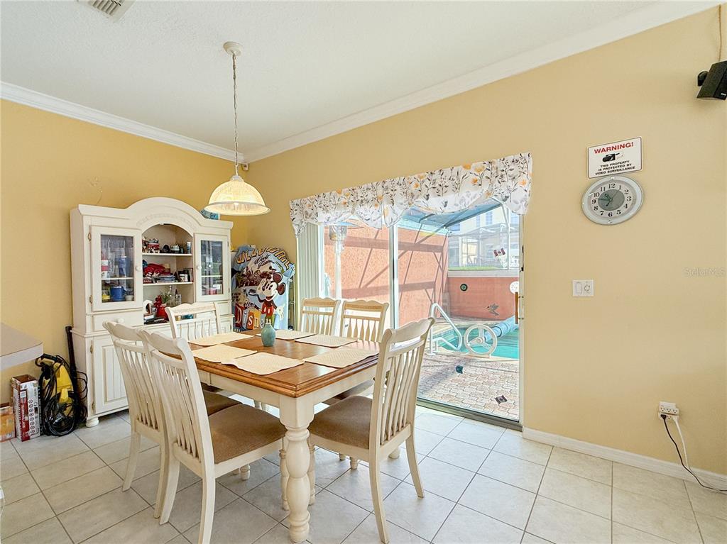 8535 Bay Lilly Loop Kissimmee, FL 34747 - Photo 3 of 57 a view of a dining room with furniture window and outside view