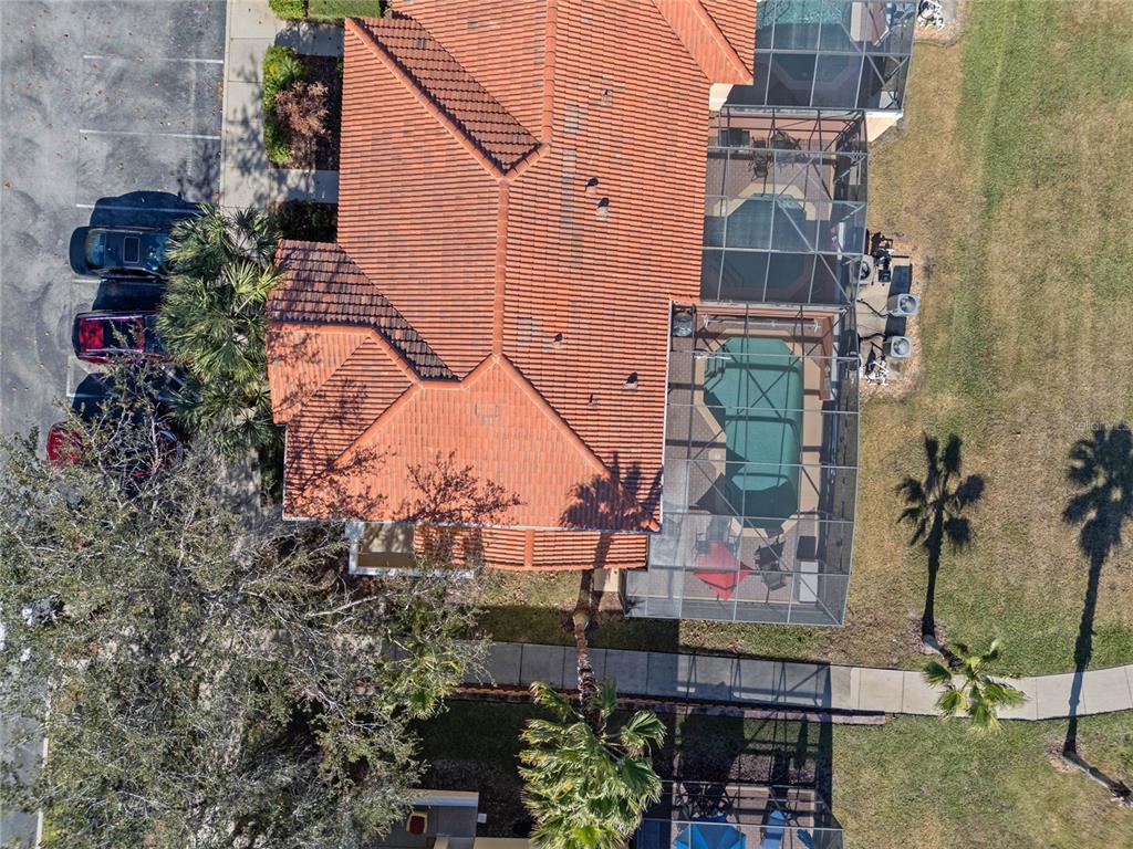 8535 Bay Lilly Loop Kissimmee, FL 34747 - Photo 32 of 57 an aerial view of a house with a yard and large trees