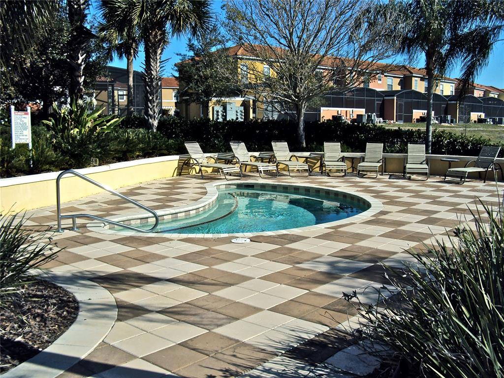 8535 Bay Lilly Loop Kissimmee, FL 34747 - Photo 45 of 57 a view of a swimming pool with a patio