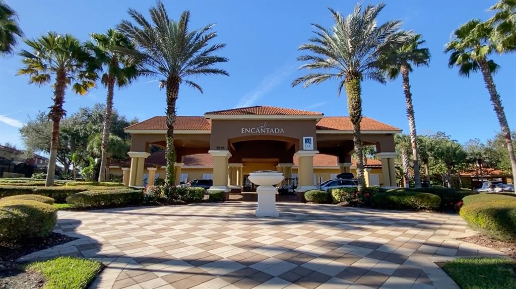 8535 Bay Lilly Loop Kissimmee, FL 34747 - Photo 50 of 57 a front view of a house with garden and trees