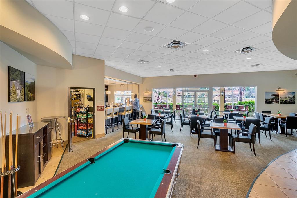 8535 Bay Lilly Loop Kissimmee, FL 34747 - Photo 51 of 57 a living room with furniture and a large window