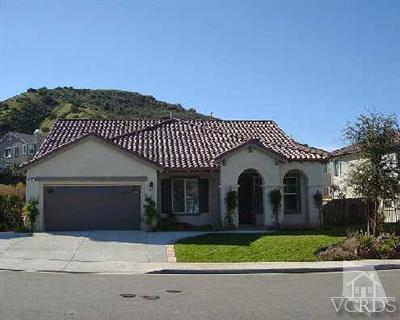 1497 Hidden Ranch Drive Simi Valley, CA 93063 - Photo 1 of 9 a front view of a house with a garden