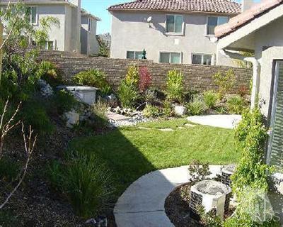 1497 Hidden Ranch Drive Simi Valley, CA 93063 - Photo 5 of 9 a front view of a house with a yard
