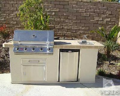 1497 Hidden Ranch Drive Simi Valley, CA 93063 - Photo 6 of 9 a view of a kitchen with a stove top oven