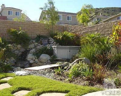 1497 Hidden Ranch Drive Simi Valley, CA 93063 - Photo 8 of 9 a view of a backyard with plants