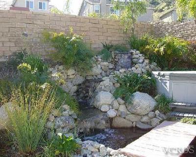 1497 Hidden Ranch Drive Simi Valley, CA 93063 - Photo 9 of 9 a view of a backyard with plants and flowers