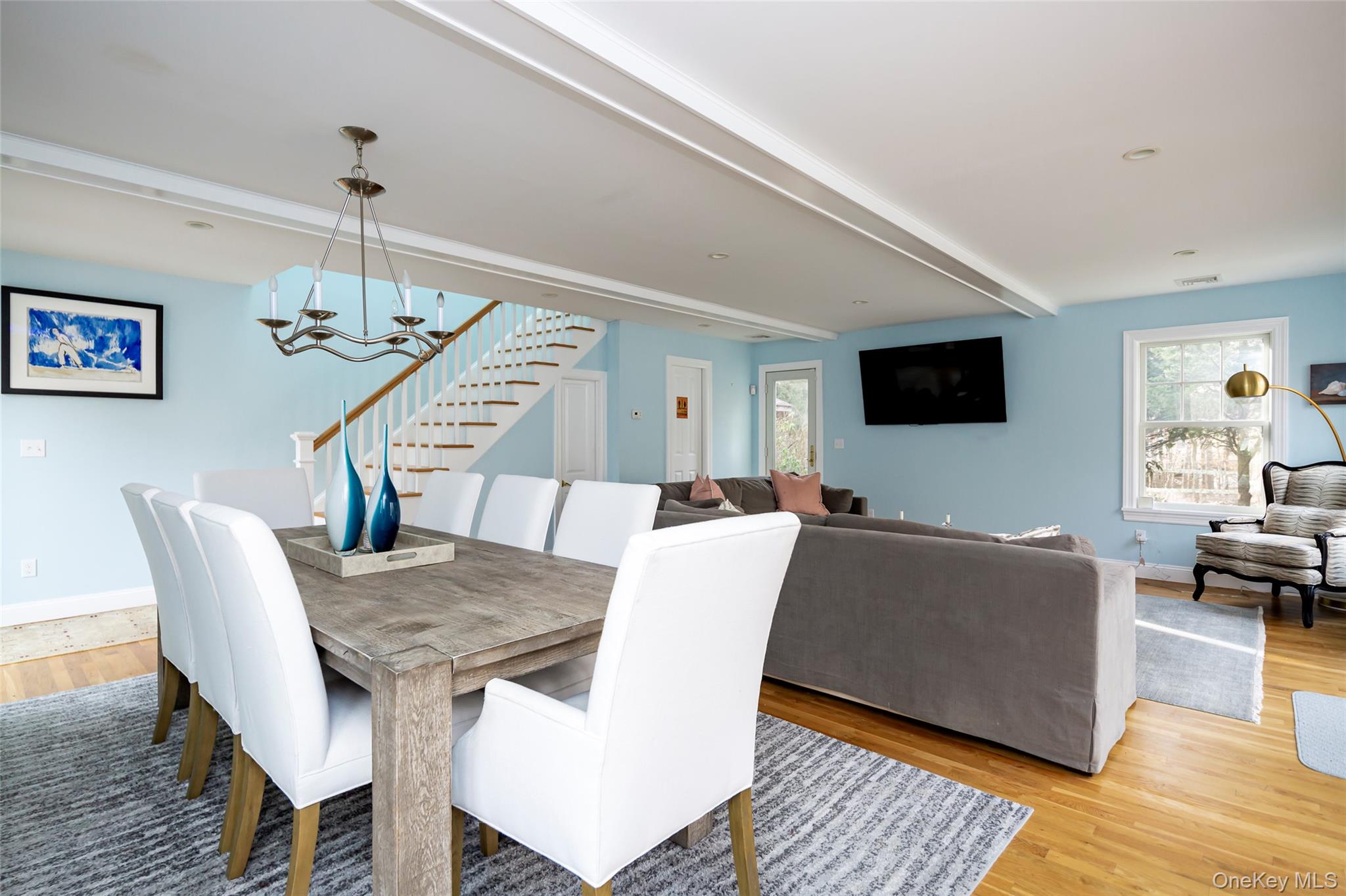 10 Deer Path East Hampton, NY 11937 - Photo 14 of 35 a living room with furniture a flat screen tv and a wooden floor