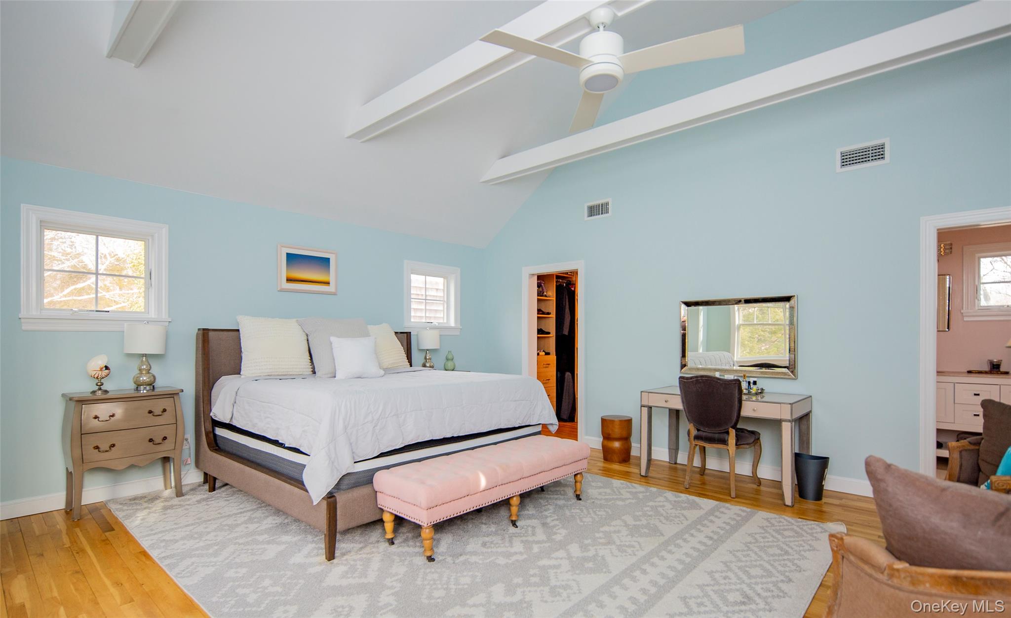 10 Deer Path East Hampton, NY 11937 - Photo 18 of 35 a bedroom with a bed and wooden floor