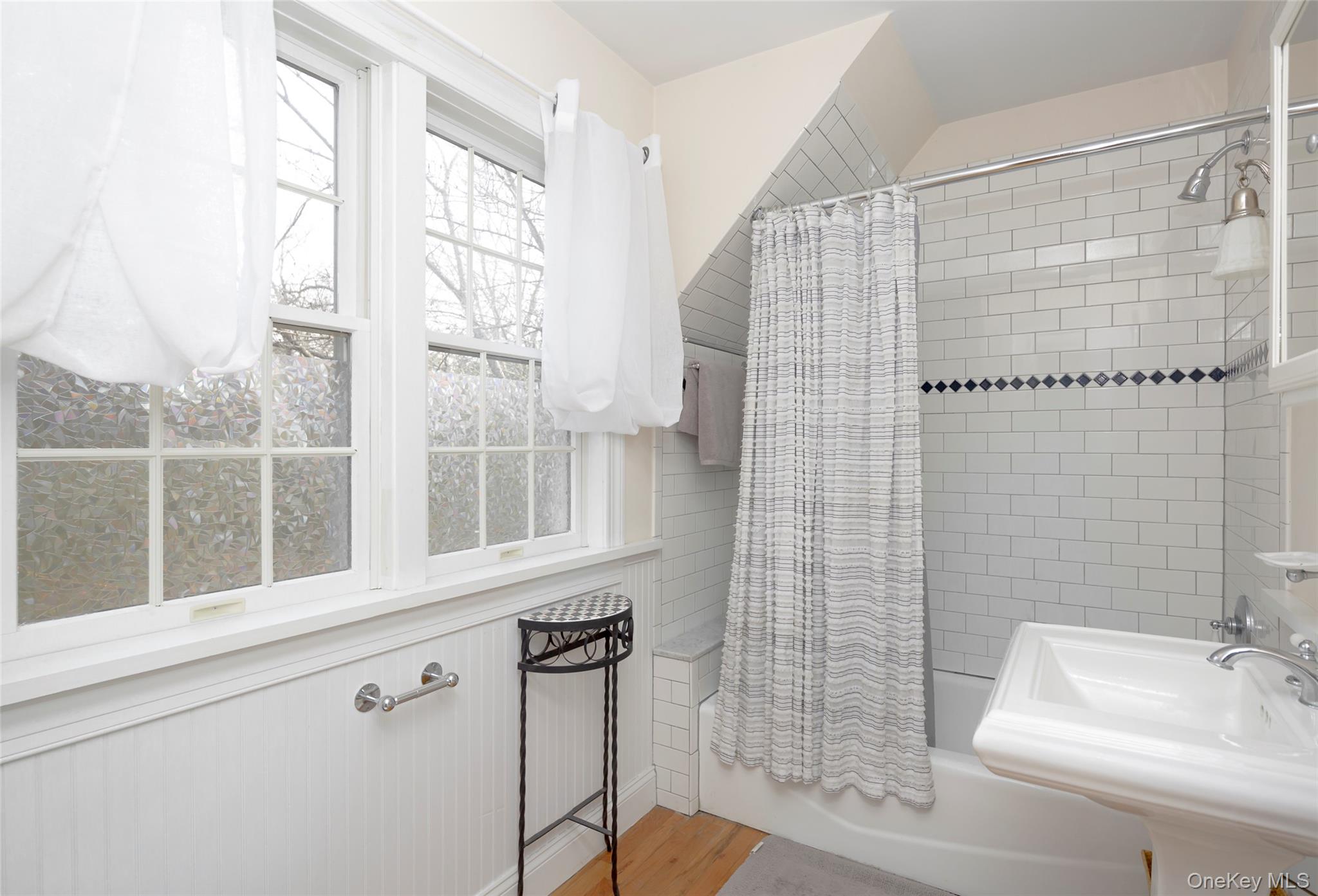10 Deer Path East Hampton, NY 11937 - Photo 26 of 35 a bathroom with a shower and a sink