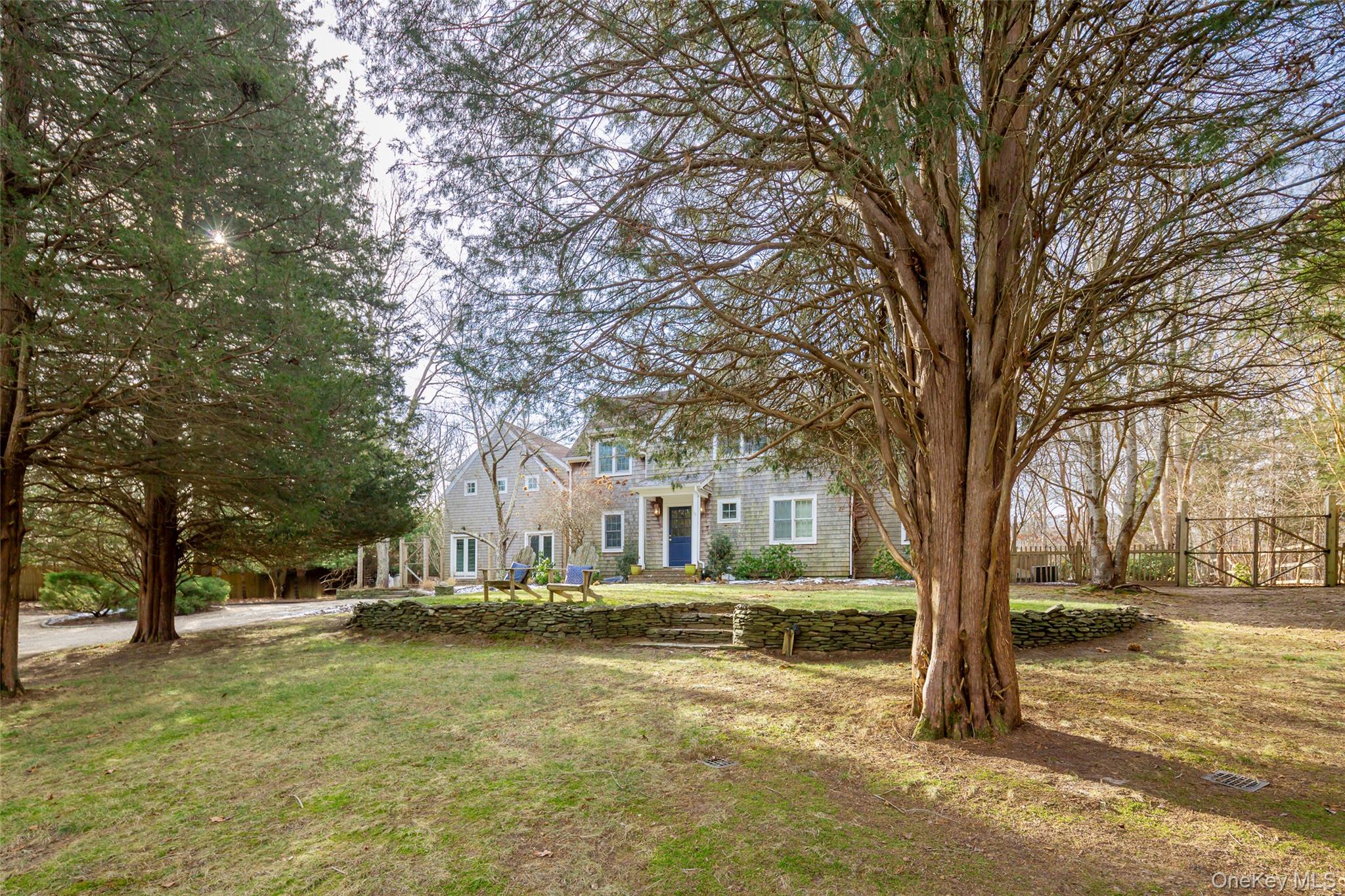 10 Deer Path East Hampton, NY 11937 - Photo 3 of 35 a view of residential house with trees