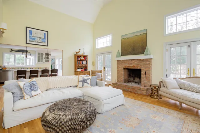 a living room with furniture a rug and a fireplace
