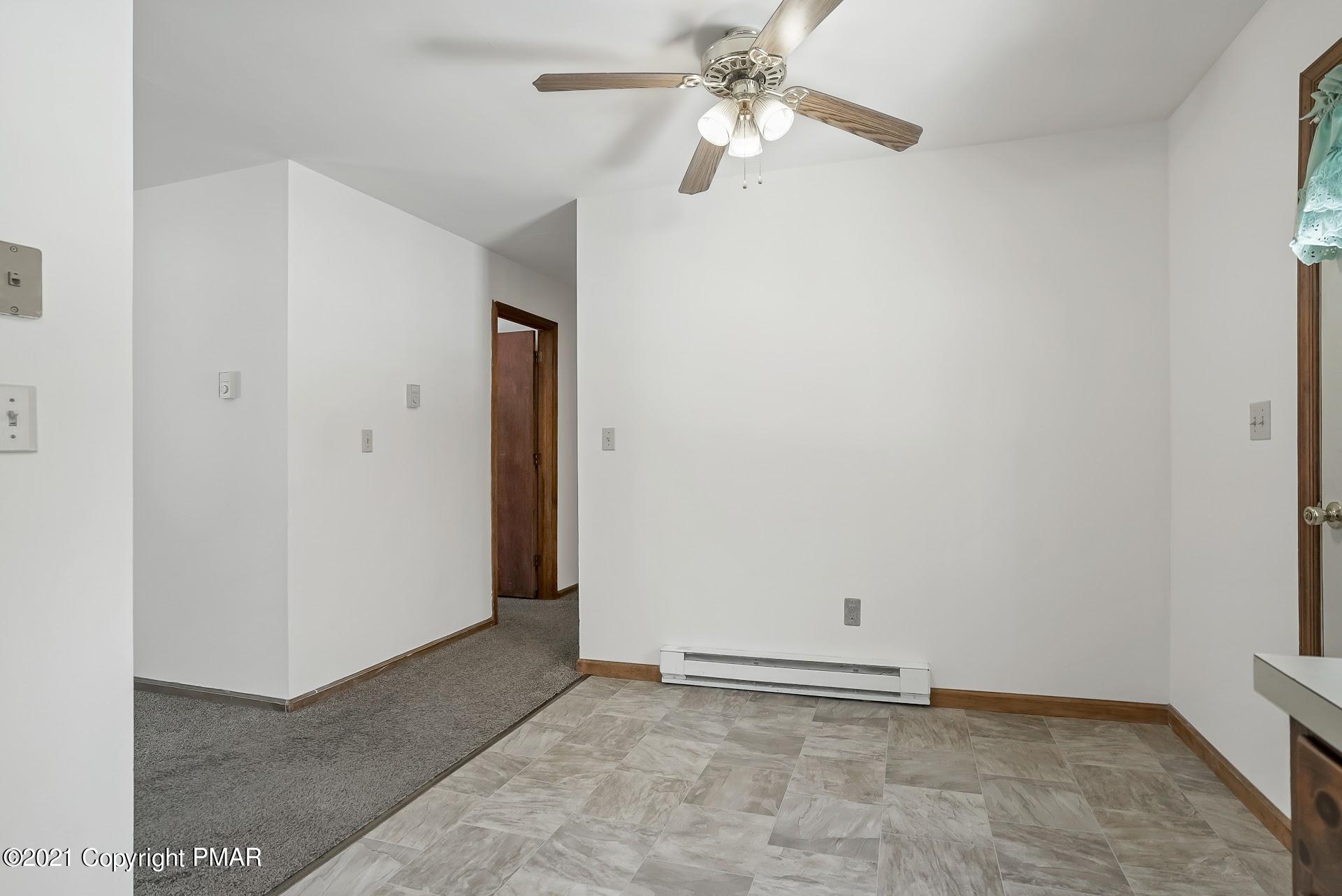 1908 Johns Road Effort, PA 18330 - Photo 10 of 23 an empty room with closet and a chandelier fan