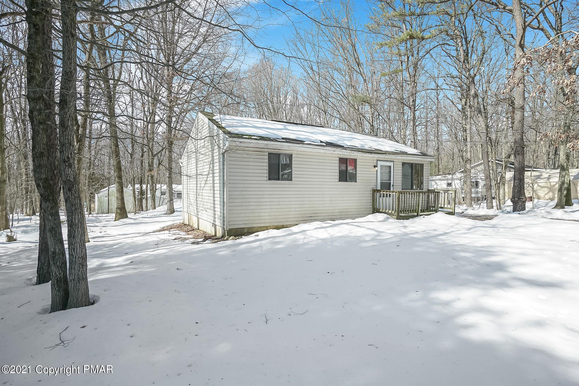 1908 Johns Road Effort, PA 18330 - Photo 2 of 23 a view of a house with a yard covered in snow