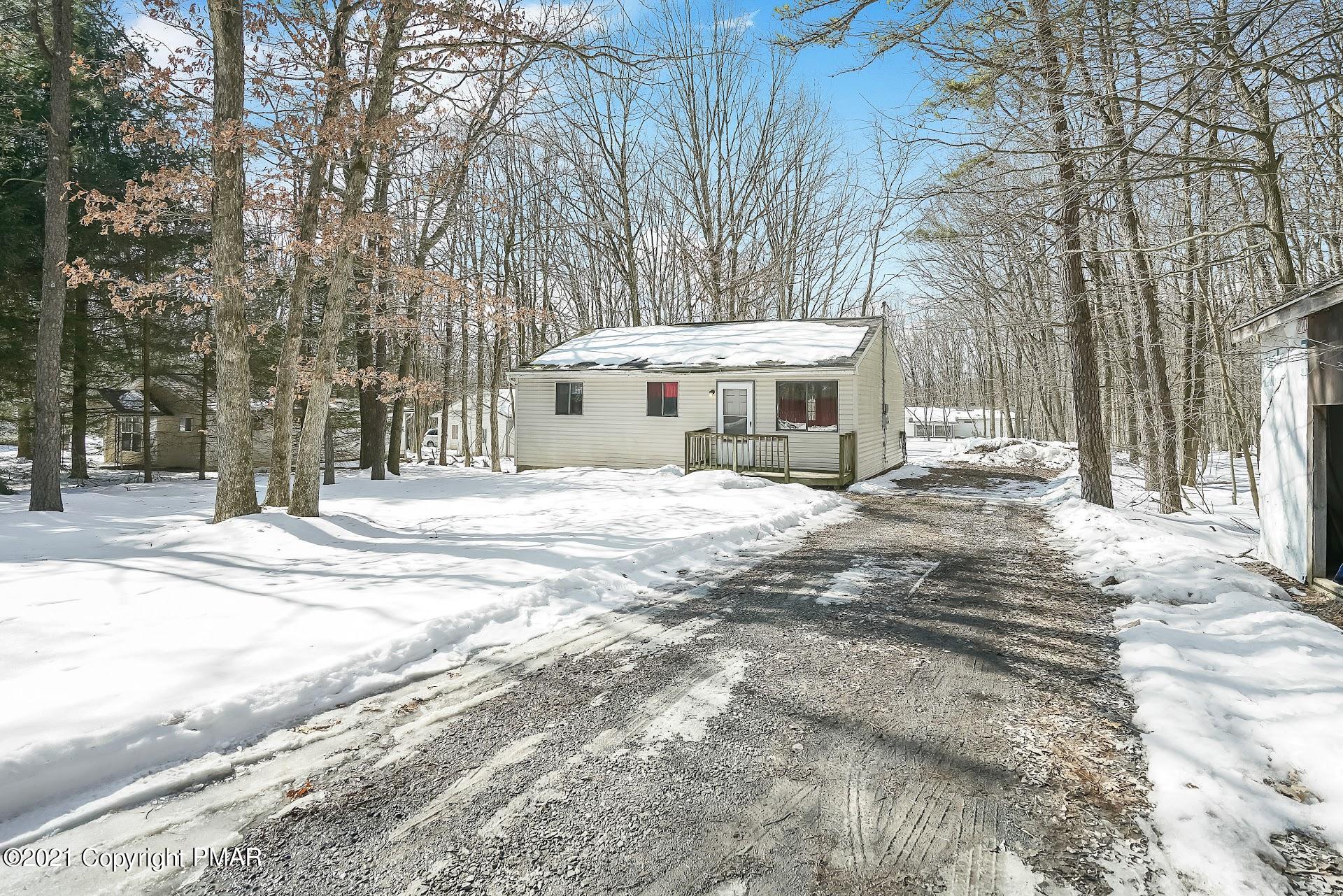 1908 Johns Road Effort, PA 18330 - Photo 21 of 23 a view of a house with a yard covered in snow