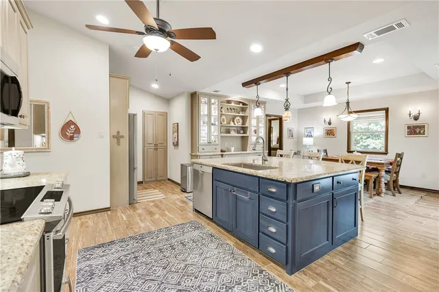 a dining room with wooden floor and a window