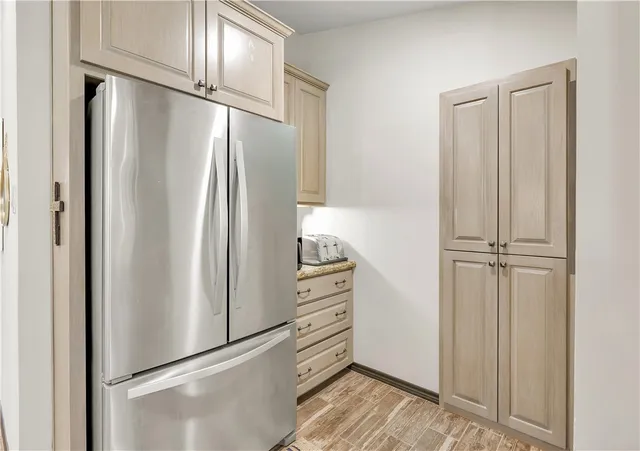 a kitchen with sink and cabinets