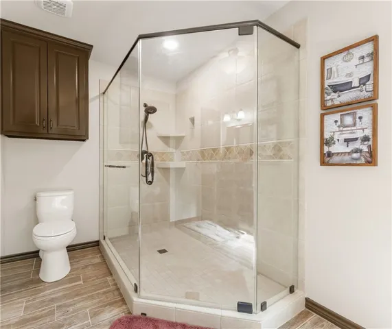 a view of walk in closet with clothes