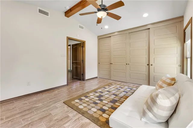 a living room with furniture and a rug