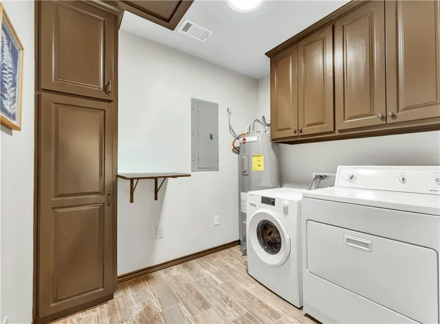 a bathroom with a granite countertop sink a toilet and a mirror