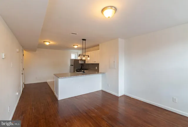 a view of kitchen with wooden floor