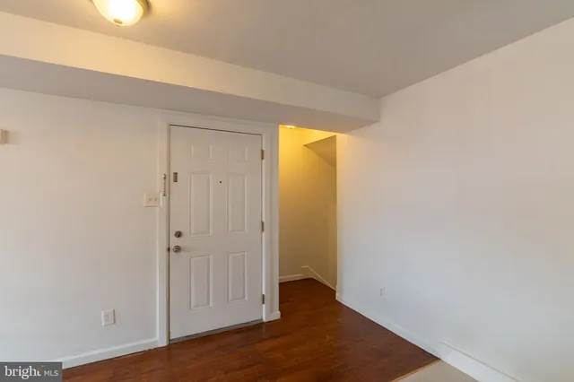 a view of a small space with wooden floor