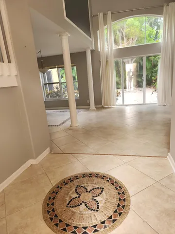 an empty room with a fireplace and painted walls