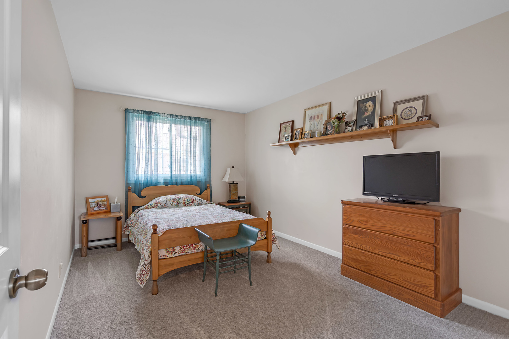 1256 Reading Court Wheaton, IL 60189 - Photo 20 of 34 a bedroom with a bed and flat screen tv