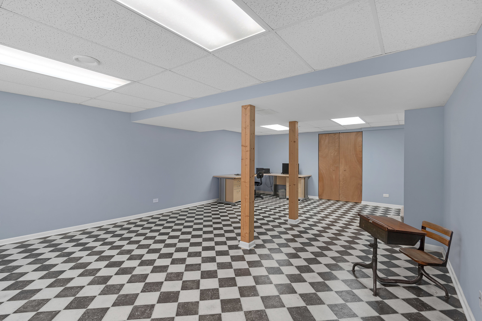 1256 Reading Court Wheaton, IL 60189 - Photo 24 of 34 a living room with a black white checkered floor with a black white checkered floor