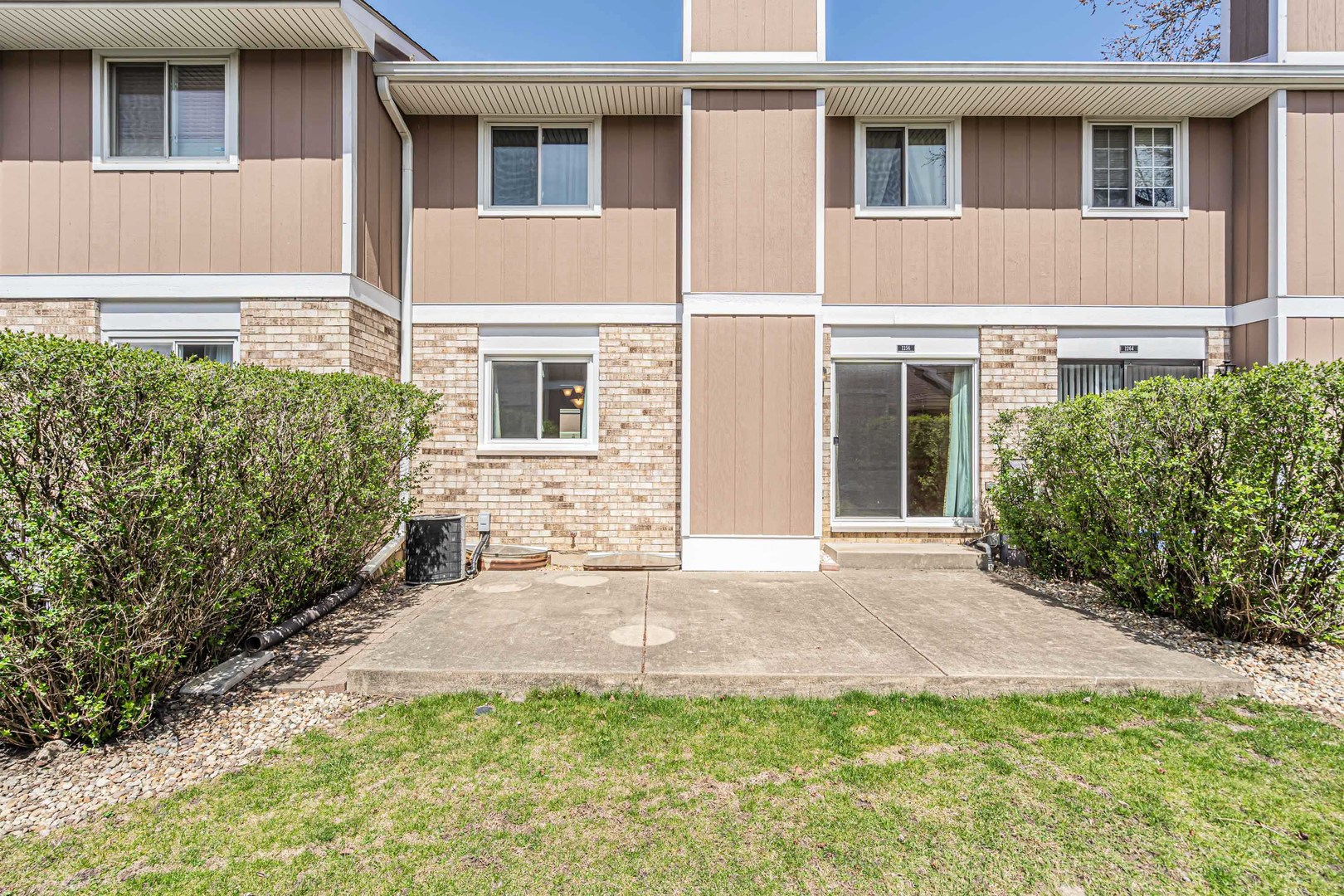 1256 Reading Court Wheaton, IL 60189 - Photo 26 of 34 a front view of a house with a yard and garage