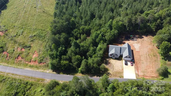 an aerial view of residential house with outdoor space