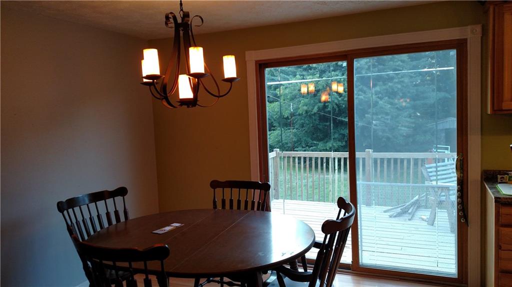 131 Squirrel Hollow Road Gibsonia, PA 15044 - Photo 8 of 17 Open concept dining room with access to the huge deck and yard surrounded by mature trees!