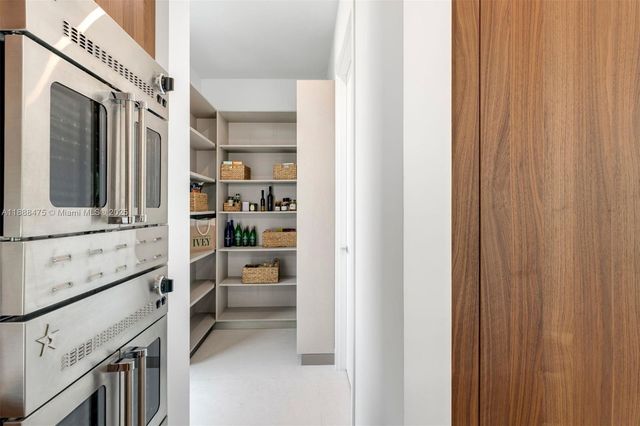 a bathroom with a double vanity sink a toilet and a mirror