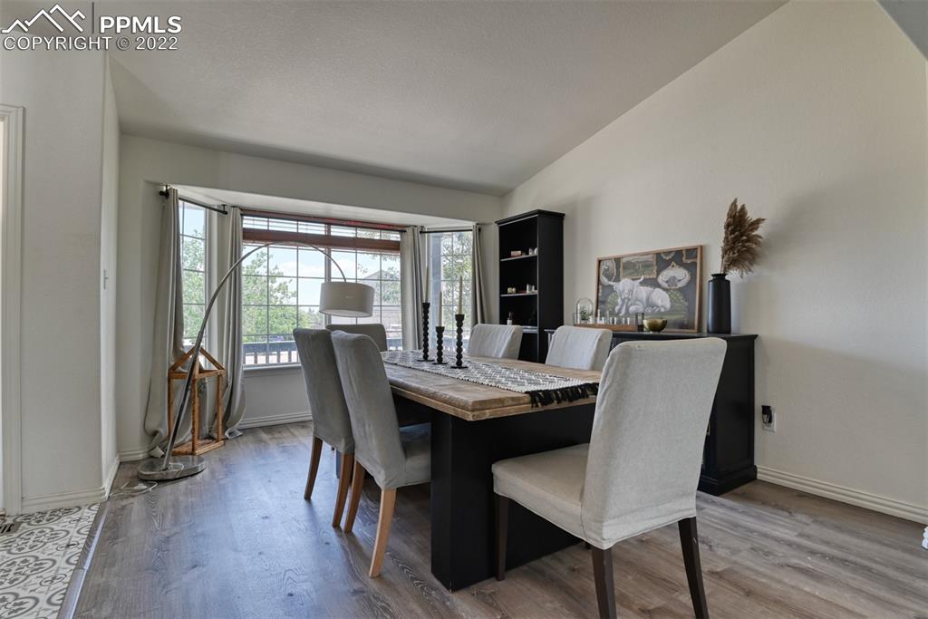 8820 Oakmont Road Peyton, CO 80831 - Photo 12 of 50 a dining room with furniture window and wooden floor