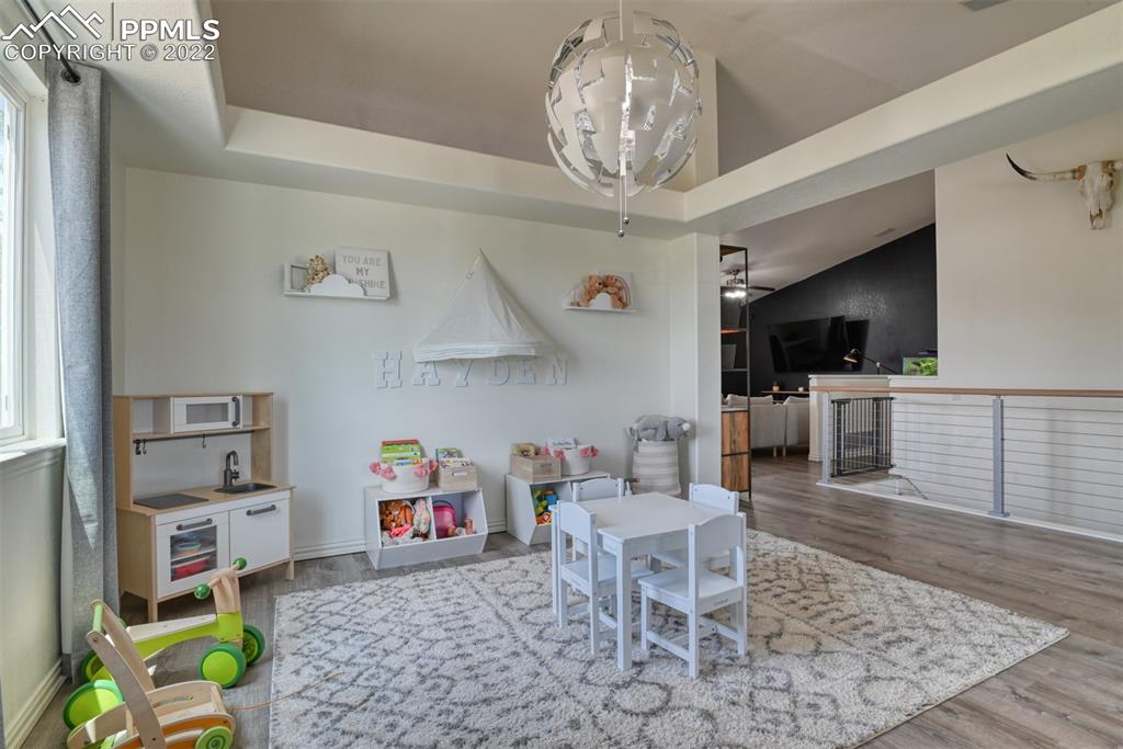 8820 Oakmont Road Peyton, CO 80831 - Photo 15 of 50 a living room with furniture and a kitchen view