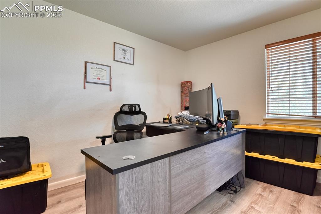 8820 Oakmont Road Peyton, CO 80831 - Photo 19 of 50 a living room with furniture and a window