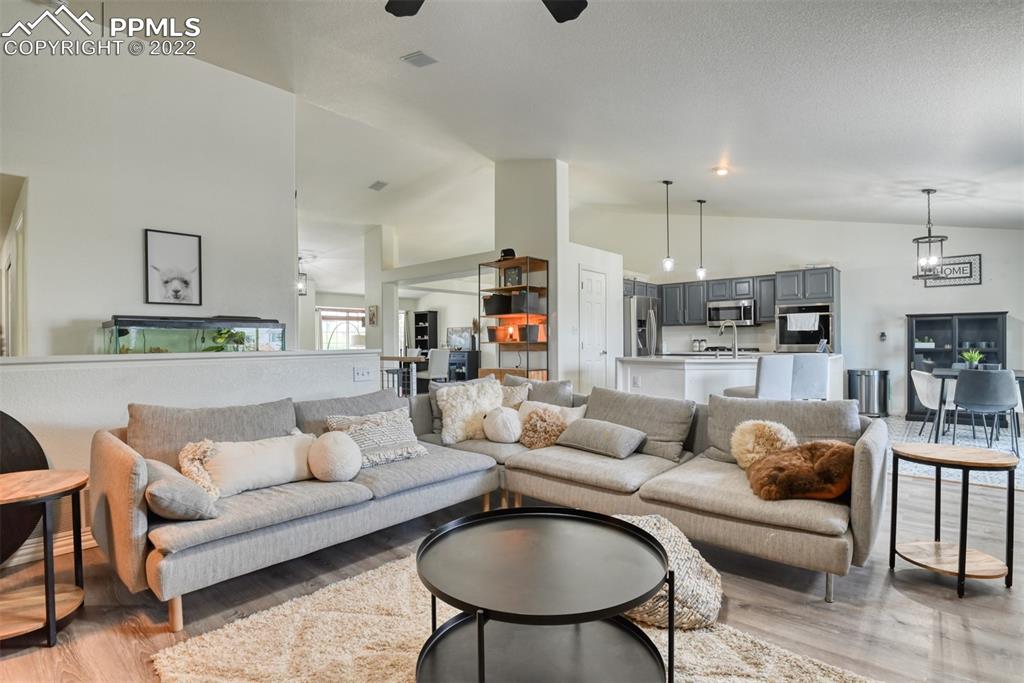 8820 Oakmont Road Peyton, CO 80831 - Photo 24 of 50 a living room with furniture and kitchen view
