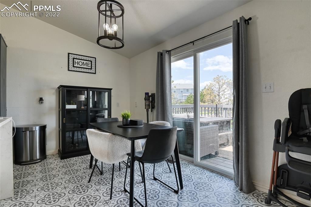8820 Oakmont Road Peyton, CO 80831 - Photo 26 of 50 a view of a dining room with furniture window and outside view