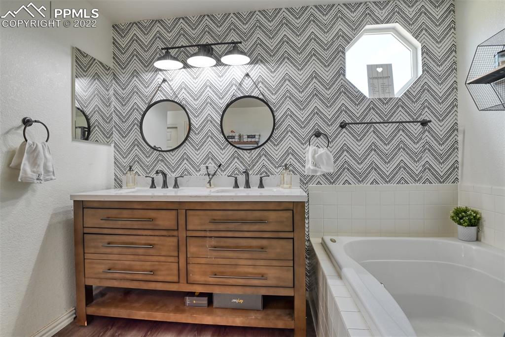 8820 Oakmont Road Peyton, CO 80831 - Photo 41 of 50 a bathroom with a sink and a mirror