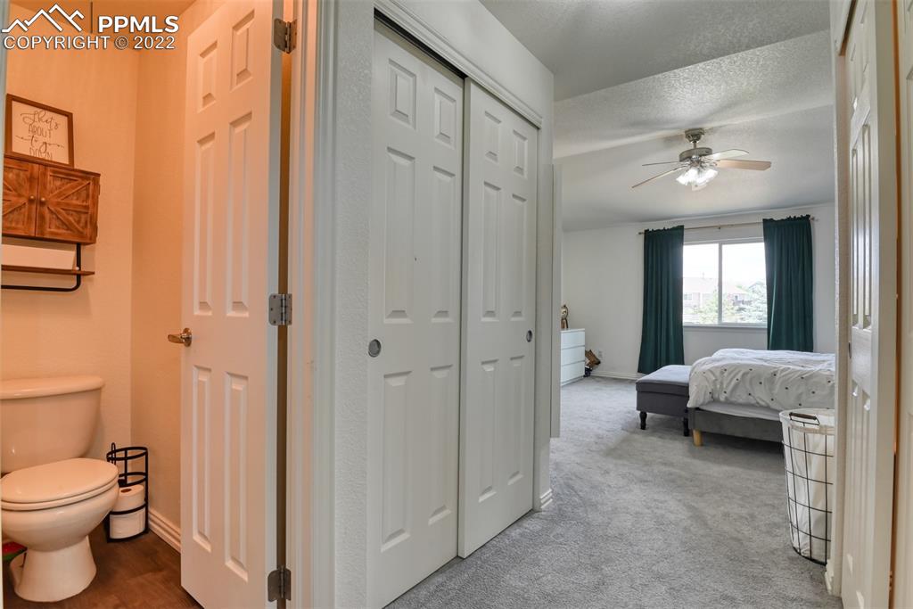 8820 Oakmont Road Peyton, CO 80831 - Photo 43 of 50 a spacious bedroom with a bed and a view of bathroom