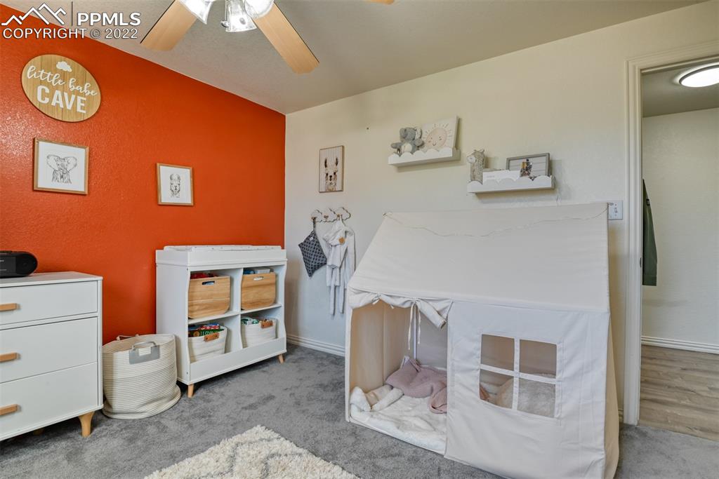 8820 Oakmont Road Peyton, CO 80831 - Photo 48 of 50 a living room with furniture and a table